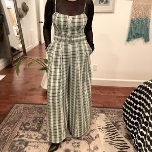 Free People Gingham wide leg jumpsuit in green.